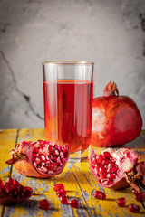 pomegranate and fresh juice in glass