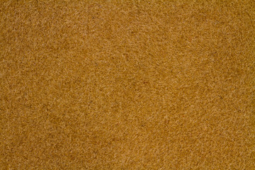 Beige, brown canvas or velvet paper texture. Closeup