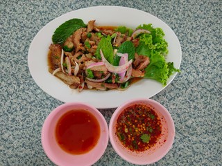 Hot and Spicy Grilled Pork Salad on disk, top view