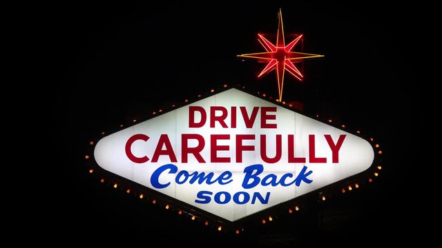 " Drive carefully come back soon " is shown on the reverse of the iconic Las Vegas sign. The 25-foot-tall sign was designed and installed in 1959 and marks the southern end of the Las Vegas Strip.