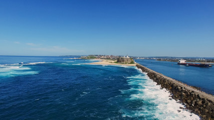 aerial shot of nobbys head lighthouse in newcastle