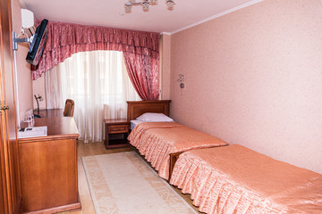 Interior of hotel apartment, bedroom. Luxury or classic bedroom with warm light of hotel resort.