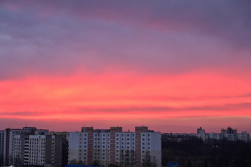 Fototapeta na wymiar Photo of gloomy sky colororg over the city in the morning