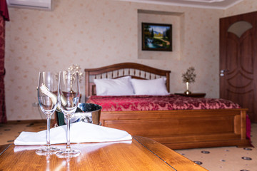 Interior of hotel apartment, bedroom. Luxury or classic bedroom with warm light of hotel resort.