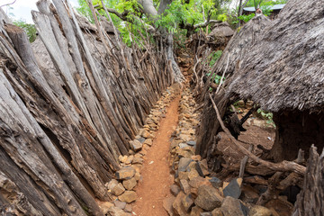 Narrow pathway in Konso, walled village tribes Konso. Africa, Ethiopia. Konso villages are listed as UNESCO World Heritage sites.