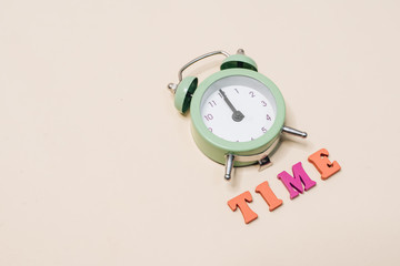 green alarm clock, wake up in the morning,  healthy sleep, work time