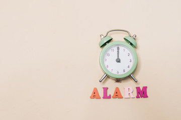 green alarm clock, wake up in the morning,  healthy sleep, work time