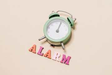 green alarm clock, wake up in the morning,  healthy sleep, work time