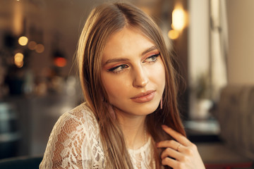 Beautiful female model portrait in a cafe
