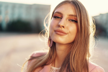 Close up portrait of a woman walking in the street