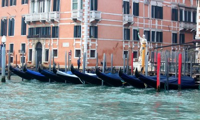 Fototapeta na wymiar Venice, Italy, 28 December 2018 evocative image of gondolas moored along a pier