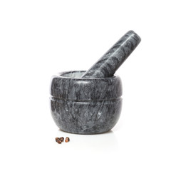 Marble mortar with pestle and black pepper peas isolated on a white background