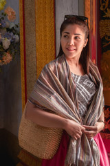 Asian beauty In a woven fabric dress
