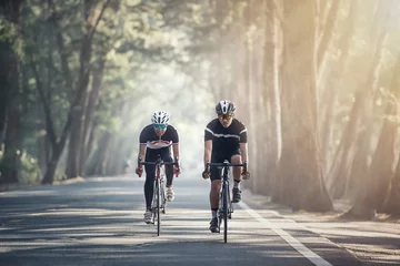 Poster Im Rahmen Asian men are cycling road bike in the morning © Sasint