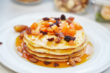 pancakes with nuts, honey and dried apricots