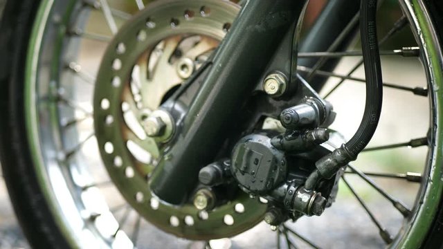 Brakes System Design Of Front Wheel Of Schooter. Brakes, Rim, Tyre, Spokes. Engine Fumes, Protecting Environment Concept