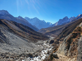 Everest base camp trek itinerary: from Machhermo to Gokyo. Beautiful views of autumn hills, snowy mountains and Dudh Koshi river valley.