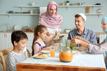 Muslim family having dinner at home