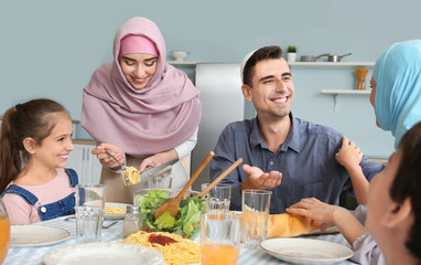 Muslim family having dinner at home