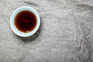 black tea cup paper background 