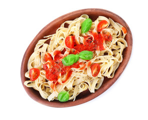 Plate with tasty pasta and tomato sauce on white background