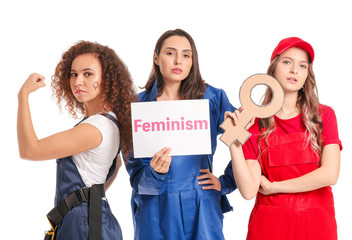 Female workers on white background. Concept of feminism