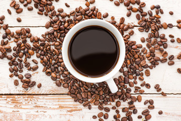 Cup of hot coffee on wooden table