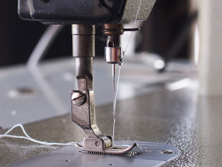 Closeup old sewing machine vintage background.