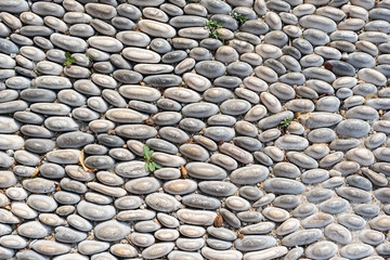 Pebble technique background. The peddles lay on the ground  in the mosaic.