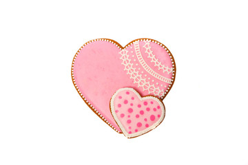 background from pink cookies heart shaped with different patterns, isolated on white
