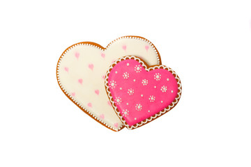 background from pink cookies heart shaped with different patterns, isolated on white