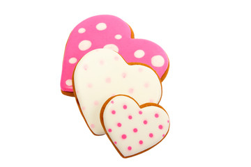 background from pink cookies heart shaped with different patterns, isolated on white
