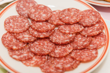 Sausage slicing at home. table setting sausage. sausage on the table.