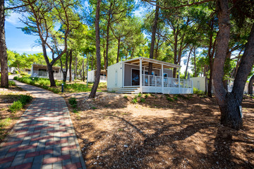 wooden camping houses on the shore, Losinj island, Croatia.