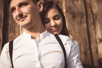 loving couple walking, having fun, hugging and kissing in the mountains