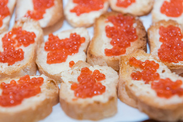 caviar with butter background. red caviar with butter close-up.