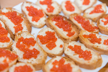caviar with butter background. red caviar with butter close-up.