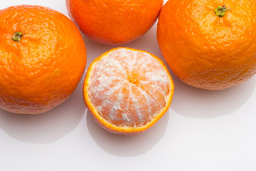 Tangerine orange-skinned sweet fruit of the citrus family.