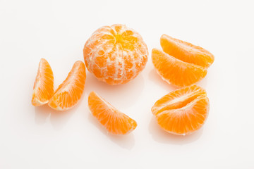 Tangerine orange-skinned sweet fruit of the citrus family.