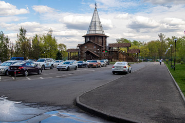Parking lot on the background of a decorative building in the park