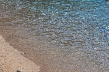 The crystal clear sea of ​​Cala Luna in the Gulf of Orosei. Beautiful destination to reach by boat on a holiday in Sardinia.