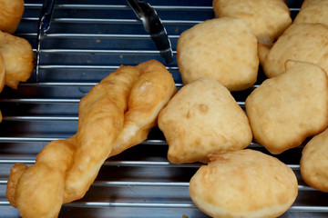 Padnoongo, Chinese style fried donut, popular street foot sold in market and space for write wording. Served with coffee or hot milk, unhealthy fried food cause heart disease, old oil cause cancer