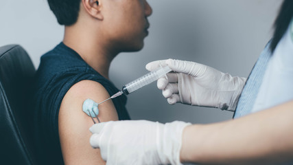 The doctor carried a syringe to treat and gave the patient a Sein measurement.Vaccination concept. Healthcare, hospital and medical diagnostics.