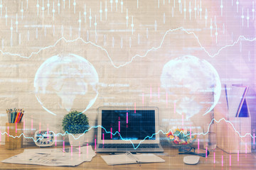 Financial graph colorful drawing and table with computer on background. Double exposure. Concept of international markets.