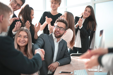 handshake of business people at a meeting in the office