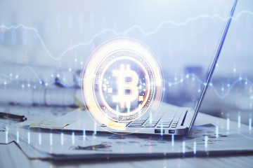 Double exposure of blockchain theme hologram and table with computer background. Concept of bitcoin crypto currency.