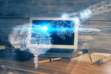 Double exposure of work table with computer and brain sketch hologram. Brainstorming concept.