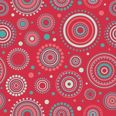 Seamless mandala pattern with circles and dots on red background.