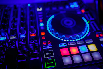 closeup view of a DJ's mixing desk
