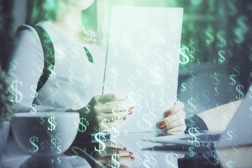 Double exposure of hands making notes with forex chart huds. Stock market concept.